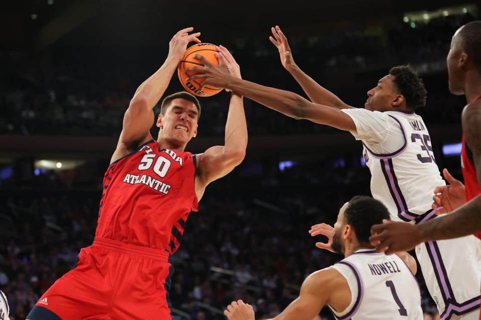 Florida Atlantic Owls center Vladislav Goldin (50) attempts a shot as Kansas State Wildcats forward Nae'Qwan Tomlin (35) blocks during the second half of an NCAA Tournament East Regional final at Madison Square Garden.