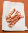 <div class="cls"> Cook Bacon <p class="caption">Sandwich 6 slices of bacon between 2 double layers of paper towels. Place on a microwave-safe plate. Microwave on high (power level 10) until cooked through, 4 to 5 minutes. <br><br> <strong><a href="http://www.realsimple.com/food-recipes/shopping-storing/food/common-cuts-pork-00000000040560/index.html?xid=yshi-rs-microwave-091710" rel="nofollow noopener" target="_blank" data-ylk="slk:Related: Common Cuts of Pork;elm:context_link;itc:0;sec:content-canvas" class="link ">Related: Common Cuts of Pork</a></strong></p> Photo by: Getty </div>