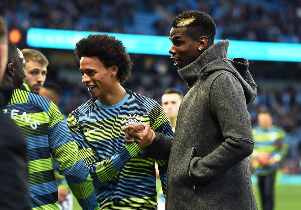 MANCHESTER, ENGLAND – NOVEMBER 11: Paul Pogba of Manchester United greets Leroy Sane of Manchester City before during the Premier League match between Manchester City and Manchester United at Etihad Stadium on November 11, 2018 in Manchester, United Kingdom. (Photo by Manchester City FC/Man City via Getty Images)