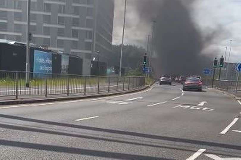 Thick plumes of black smoke covered the area after the car caught fire