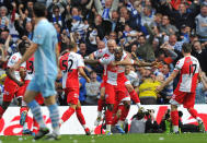 Queens Park Rangers French striker Djibril Cisse (2nd R) celebrates scoring his goal with team-mates during the English Premier League football match between Manchester City and Queens Park Rangers at The Etihad stadium in Manchester, north-west England on May 13, 2012. AFP PHOTO/PAUL ELLIS RESTRICTED TO EDITORIAL USE. No use with unauthorized audio, video, data, fixture lists, club/league logos or 'live' services. Online in-match use limited to 45 images, no video emulation. No use in betting, games or single club/league/player publications.PAUL ELLIS/AFP/GettyImages