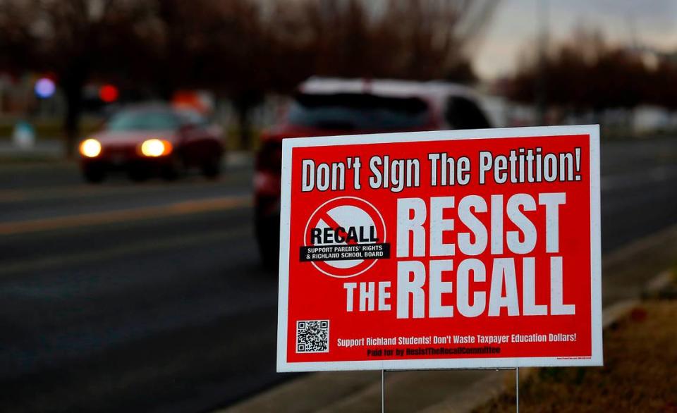 A Resist the Recall sign supports three members of the Richland School Board facing recall.