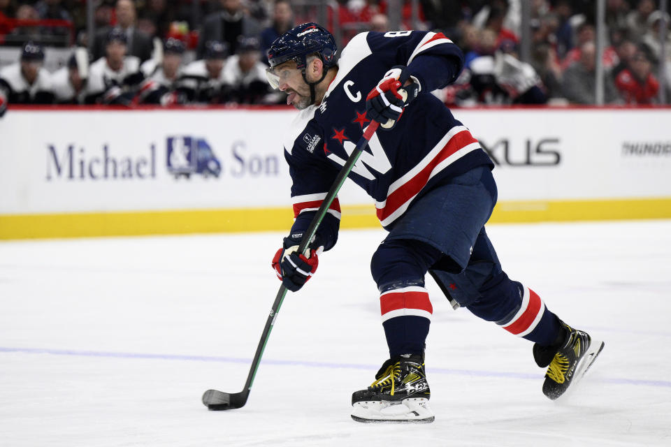 Washington Capitals left wing Alex Ovechkin (8) shoots during the first period of an NHL hockey game against the Montreal Canadiens, Tuesday, Feb. 6, 2024, in Washington. (AP Photo/Nick Wass)