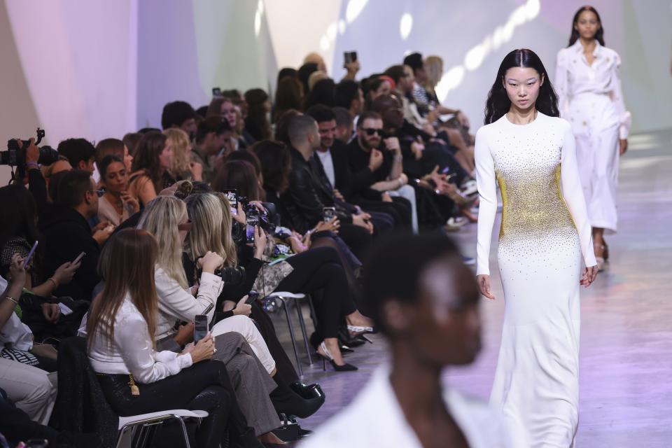 Models wear creations for the Elie Saab ready-to-wear Spring/Summer 2023 fashion collection presented Saturday, Oct. 1, 2022 in Paris. (Photo by Vianney Le Caer/Invision/AP)