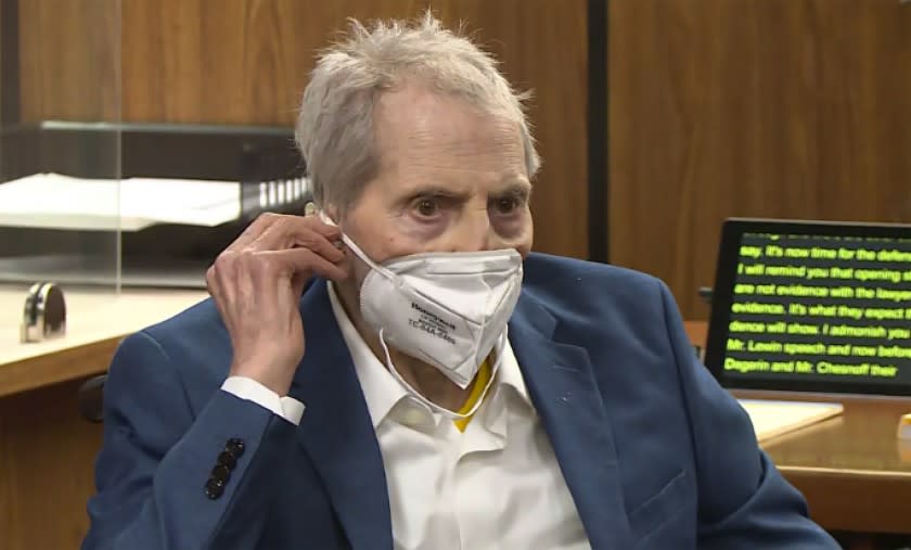 FILE - In this still image taken from the Law&Crime Network court video, real estate heir Robert Durst watches as his defense attorney Dick DeGuerin presents a new round of opening statements in the murder case against Durst after a 14-month recess due to the coronavirus pandemic in Los Angeles County Superior Court in Inglewood, Calif., on Wednesday, May 19, 2021. Durst, 78, an heir to a New York commercial real estate empire, is charged with first-degree murder in the slaying of his best friend, Susan Berman. A judge on Monday, June 14 has ordered that the trial of Durst will continue, despite defense requests for a delay because he's in too much pain. Durst was hospitalized and the trial was put on pause Thursday, June 10. (Law&Crime Network via AP, Pool, File)