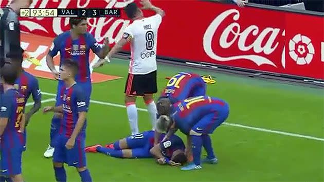 Neymar on the ground in pain after being hit by a bottle. Pic: BeIn Sports