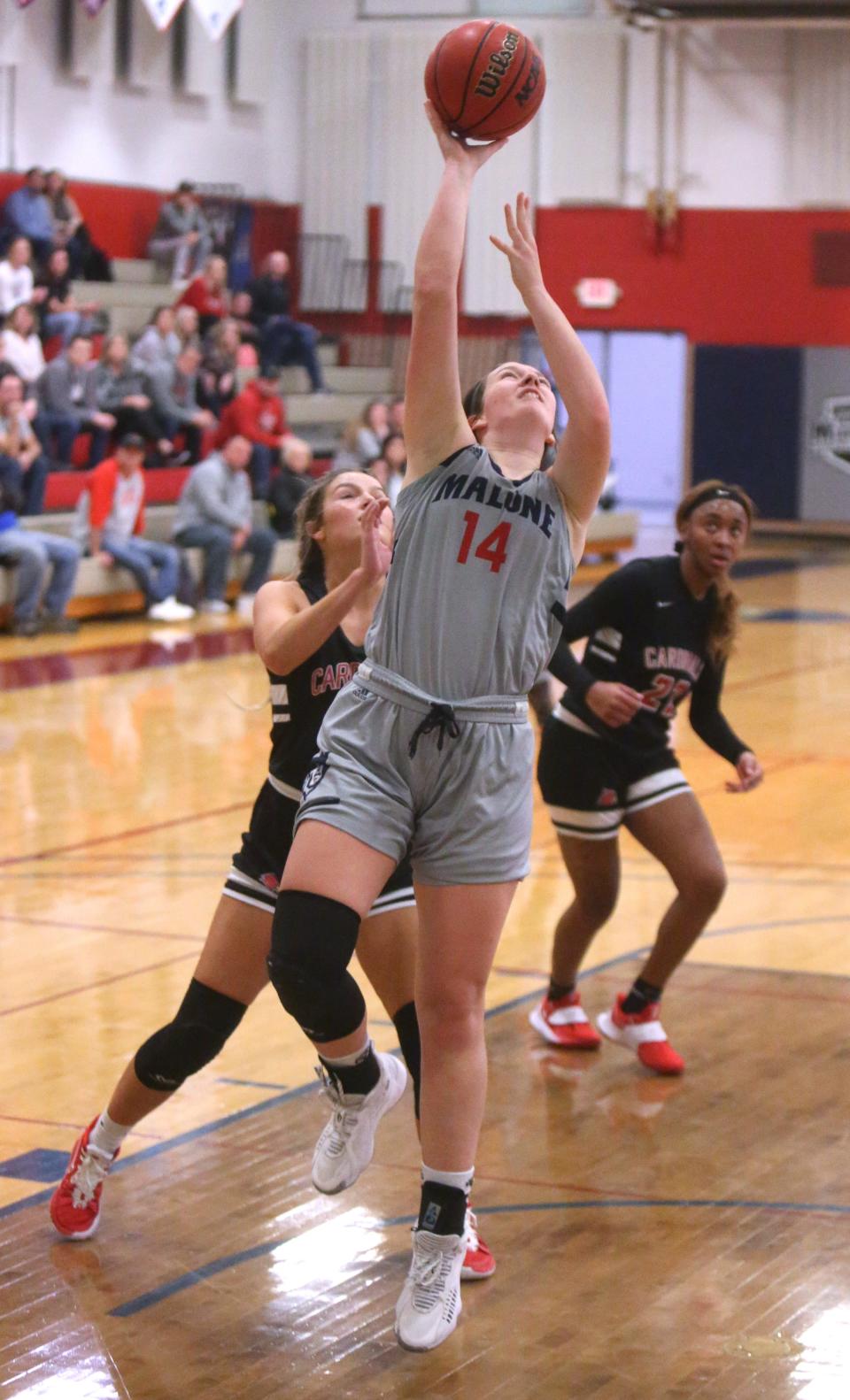 Kelsey Swihart (14) of Malone goes to the basket during their game against Wheeling at Malone on Wednesday.