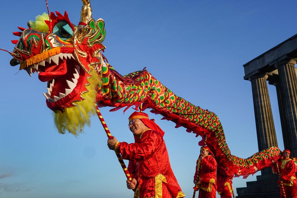 A look at the global celebration: Members of the Edinburgh, Scotland Chinese community kick-off the city's Chinese New Year Festival on Jan. 8, 2020.