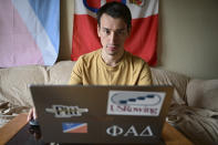 Amateur trader Manny Marotta looks at stock prices on his laptop in his apartment in Rocky River, Ohio, Wednesday, April 24, 2024. The legal writer from suburban Cleveland had been up about $4,000 on “put” options for Trump Media & Technology stock, purchased over the past few weeks. (AP Photo/David Dermer)