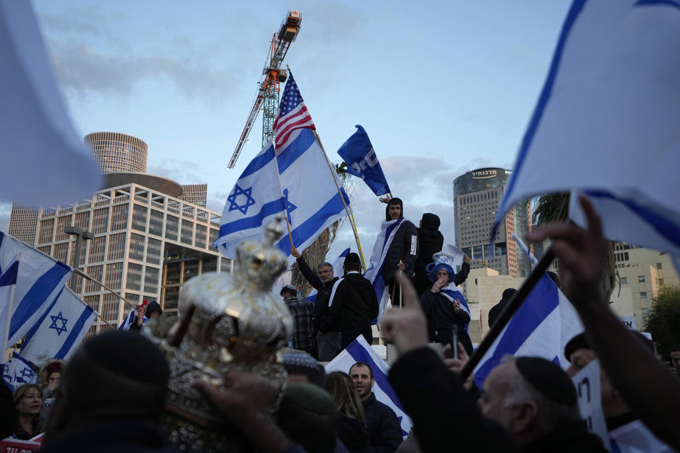 Right-wing Israelis rally in support of Prime Minister Benjamin Netanyahu's government plans to overhaul the judicial system, in Tel Aviv, Israel, Thursday, March 30, 2023. (AP Photo/Ariel Schalit)