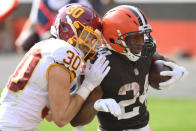 Cleveland Browns running back Nick Chubb (24) rushes for a 20-yard touchdown as Washington Football Team free safety Troy Apke (30) defends during the second half of an NFL football game, Sunday, Sept. 27, 2020, in Cleveland. The Browns won 34-20. (AP Photo/David Richard)