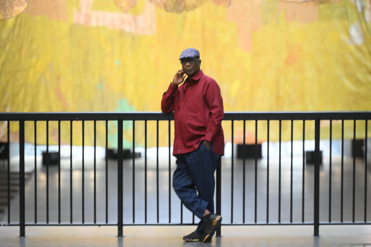 El AnaisuiI in front of his new work at Tate Modern (Daniel Hambury/Stella Pictures Ltd)