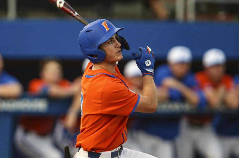 FILE - Florida outfielder Jud Fabian bats during an NCAA college baseball game against Florida A&M in Gainesville, Fla., in this Wednesday, March 4, 2020, file photo. The Gators are in a familiar place as the consensus No. 1 team in the preseason. Fabian might be the best position player in the country. (AP Photo/Gary McCullough, File)