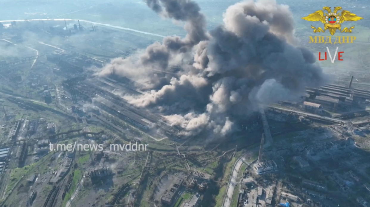 A still image from a video of an aerial view showing rising smoke after a possible shelling of the Azovstal complex.