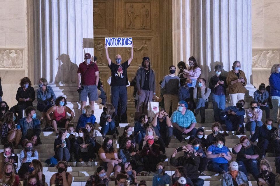 A ‘Notorious’ sign as mourners gather at the Supreme Court