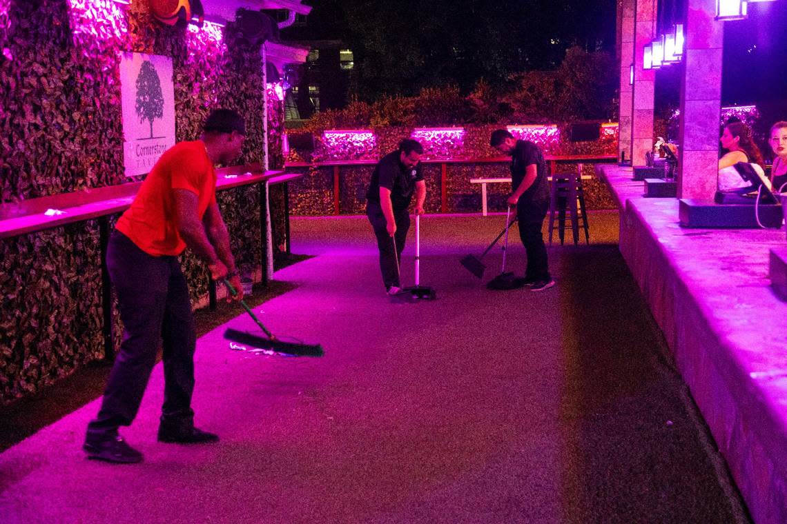 Cornerstone Tavern staff clean up after a night of partying around 2:30 a.m. in the Glenwood South district on Friday, July 21, 2023.