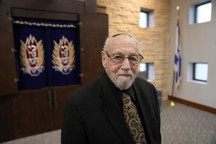 In this Dec. 22, 2022, photo, Lawrence Schwartz poses for a photo inside of Congregation Beth Israel, in Colleyville, Texas. A year ago, a rabbi and three others survived a hostage standoff at their synagogue in Colleyville, Texas. Their trauma did not disappear, though, with the FBI's killing of the pistol-wielding captor. Healing from the Jan. 15, 2022, ordeal is ongoing. (AP Photo/Tony Gutierrez)