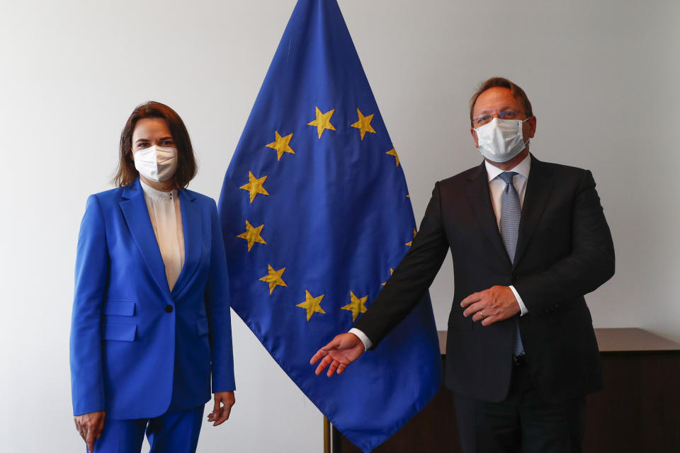 Belarusian opposition politician Sviatlana Tsikhanouskaya, left, and European Commissioner for Neighbourhood and Enlargement Oliver Varhelyi pose for a photo during a European Foreign Affairs Ministers meeting at the European Council building in Luxembourg, Monday, June 21, 2021. EU foreign ministers were set to approve Monday a new set of sanctions against scores of officials in Belarus and prepare a series of measures aimed at the country's economy. (Johanna Geron/Pool Photo via AP)