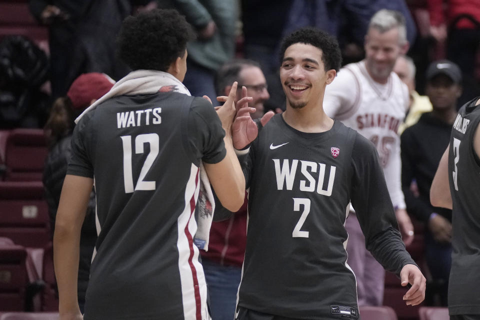 Washington State guard Isaiah Watts (12) celebrates with guard Myles Rice (2) after the team's NCAA college basketball game against Stanford in Stanford, Calif., Thursday, Jan. 18, 2024. (AP Photo/Jeff Chiu)