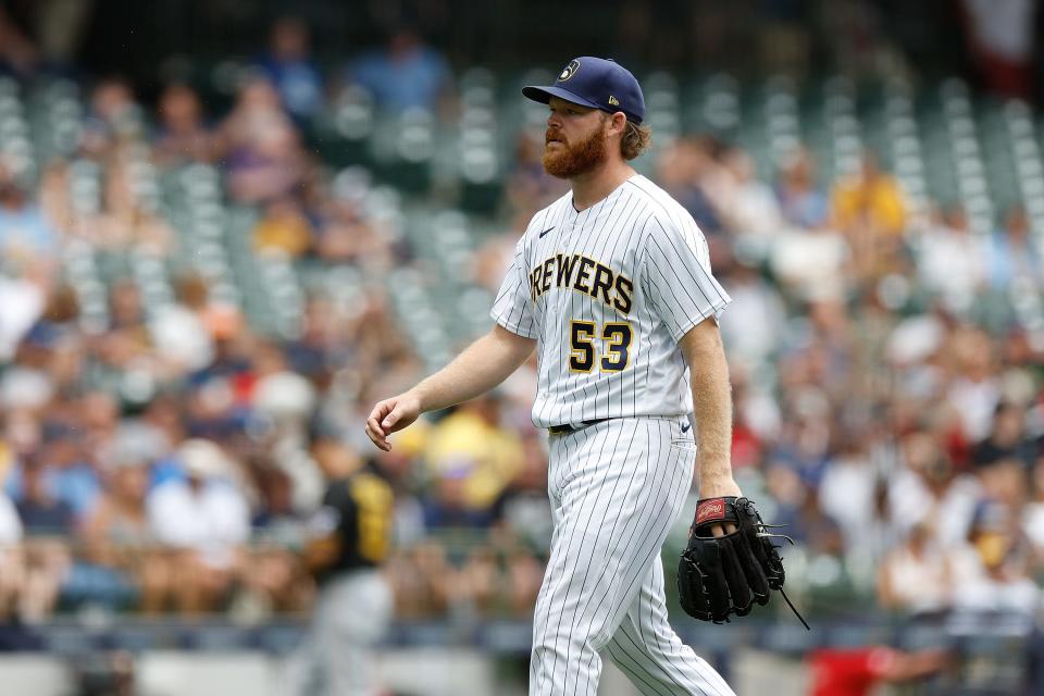 MILWAUKEE, WISCONSIN - AUGUST 06: Brandon Woodruff #53 of the Milwaukee Brewers walks to the dugout in the fifth inning against the Pittsburgh Pirates at American Family Field on August 06, 2023 in Milwaukee, Wisconsin. (Photo by John Fisher/Getty Images)