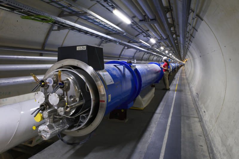 In a October 24, 2005, handout image from the European Organization for Nuclear Research, two Large Hadron Collider magnets are seen before they are connected together. On September 10, 2008, scientists in a Geneva lab activated the Large Hadron Collider, the world's largest and most powerful subatomic particle accelerator, built over a 14-year period and costing an estimated $8 billion. It had to be shut down after nine days for repairs. File Photo by Maximilien Brice/CERN