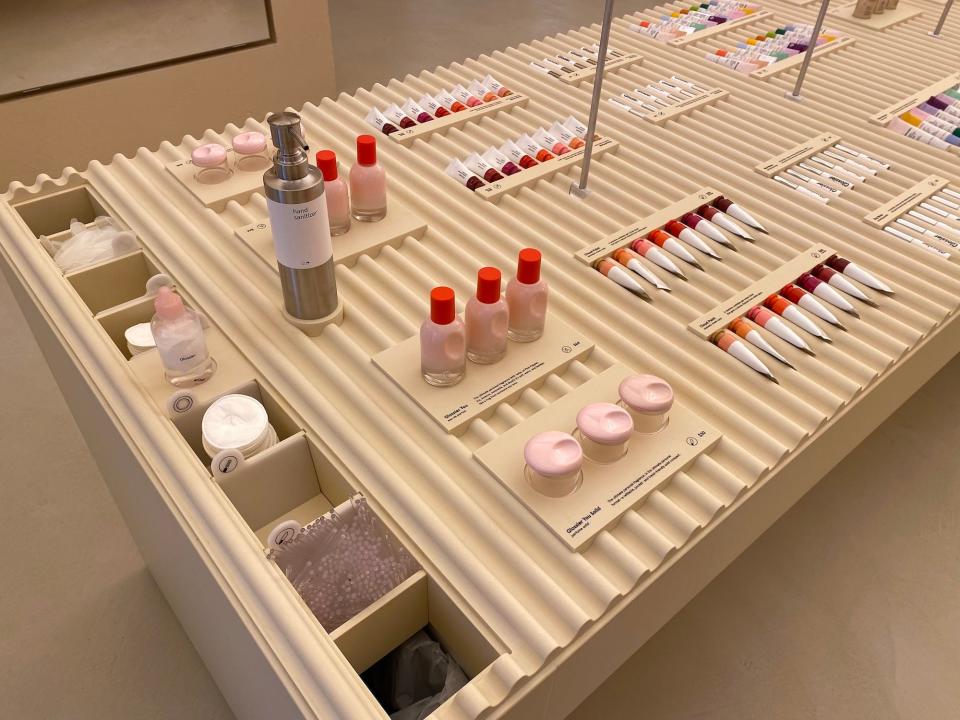 Glossier makeup on display at the brand's flagship store.
