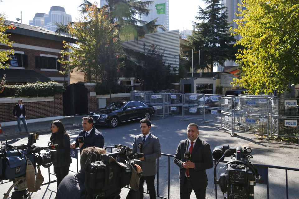 Members of the media report near Saudi Arabia's consulate, in Istanbul, Friday, Oct. 26, 2018. The Saudi officials who killed journalist Jamal Khashoggi in their Istanbul consulate must reveal the location of his body, Turkey's President Recep Tayyip Erdogan said Friday in remarks that were sharply critical of the kingdom's handling of the case.(AP Photo/Lefteris Pitarakis)