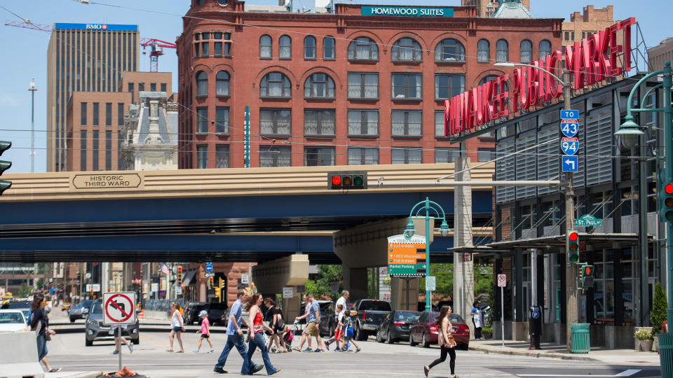 People walk in front of the Historic Third Ward's Public Market.