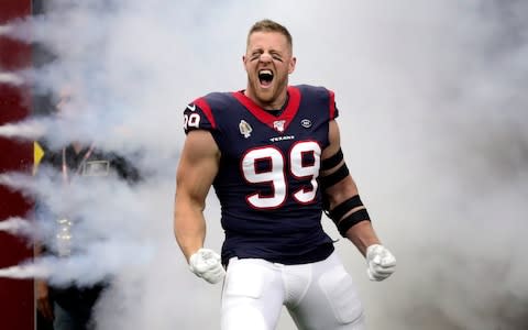 Houston Texans defensive end J.J. Watt (99) is introduced before the game against the Oakland Raiders at NRG Stadium - Credit: USA Today