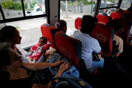 Women wait on a bus as they travel for sterilization surgery outside a hospital in Caracas, Venezuela July 27, 2016. REUTERS/Carlos Garcia Rawlins