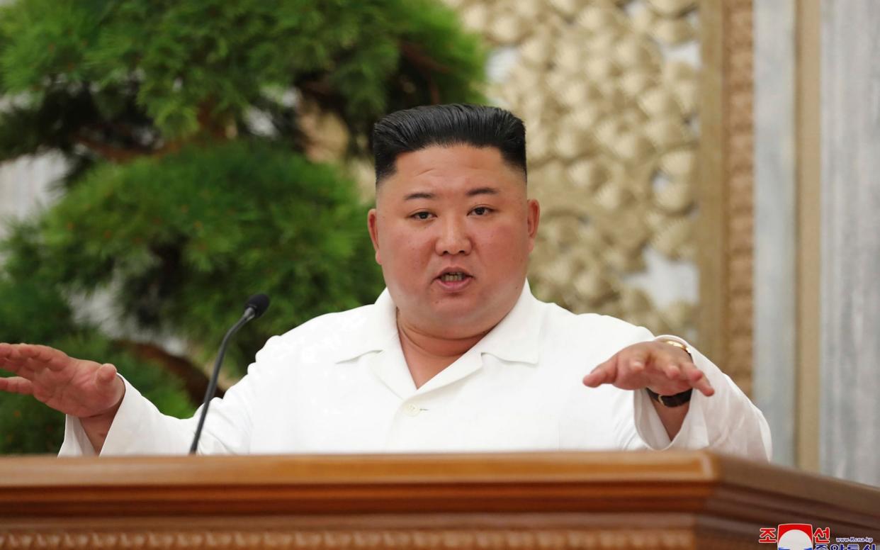 Kim told the politburo that North Korea had stopped the virus making inroads - AP