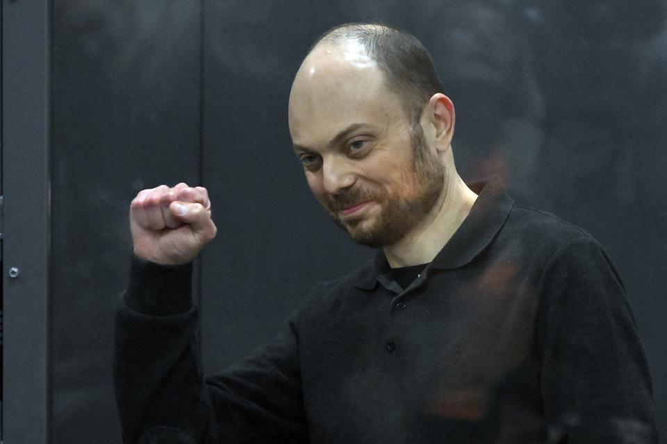 FILE - Russian opposition activist Vladimir Kara-Murza gestures standing in a glass cage in a courtroom during announcement of the verdict on appeal at the Moscow City Court in Moscow, Russia, on July 31, 2023. A lawyer of imprisoned Russian opposition politician Vladimir Kara-Murza was able to visit him in a prison hospital where he ad been held incommunicado for several days. His legal team said his health is "relatively stable". Kara-Murza, a 42-year-old dual Russian-U.K. citizen, is serving a 25-year prison sentence in a Siberian prison colony on treason charges that he has rejected. (AP Photo, File)