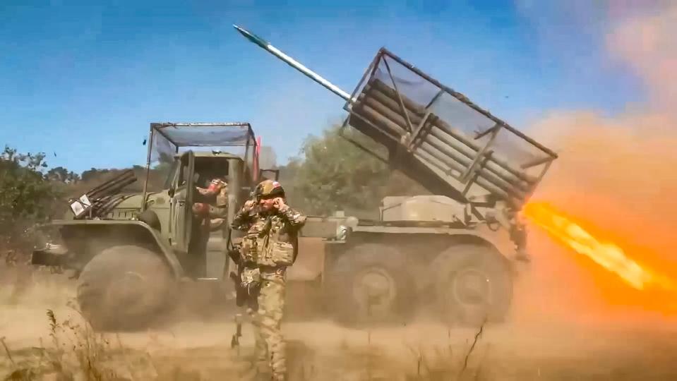 Russian Grad self-propelled multiple rocket launcher fires on an undisclosed location in Ukraine (AP)