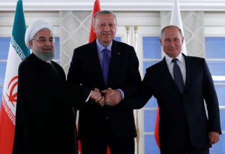 Presidents Rouhani of Iran, Erdogan of Turkey and Putin of Russia pose before their meeting in Ankara