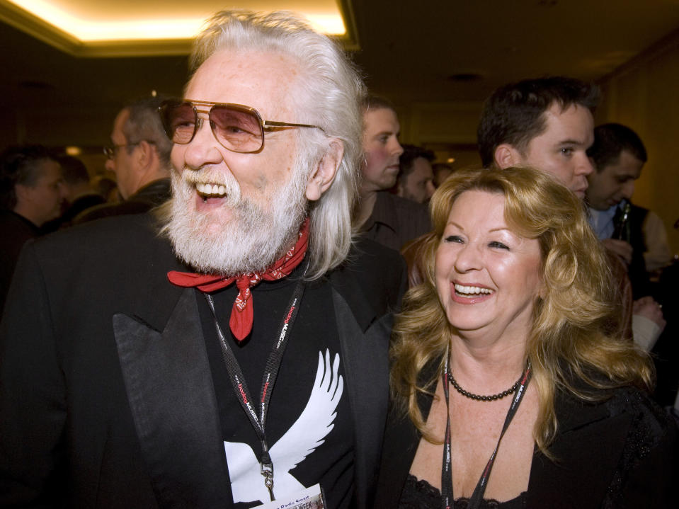 FILE - Ronnie and Wanda Hawkins arrive for the Canadian Music Industry Awards in Toronto, Thursday, March 8, 2007. Ronnie Hawkins, a brash rockabilly star from Arkansas who became a patron of the Canadian music scene after moving north and recruiting a handful of local musicians later known as the Band, died Sunday, May 29, 2022. He was 87. (Frank Gunn/The Canadian Press via AP, File)
