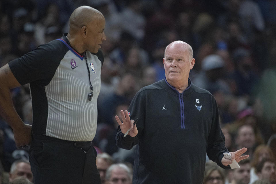 Referee Kevin Cutler listens to Charlotte Hornets head coach Steve Clifford during the first half of an NBA basketball game in Cleveland, Sunday, April 9, 2023. (AP Photo/Phil Long)