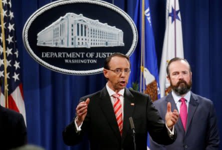 FILE PHOTO: Deputy U.S. Attorney General Rod Rosenstein announces grand jury indictments of 12 Russian intelligence officers in special counsel Robert Mueller's Russia investigation as he appears with Principal Associate Deputy Attorney General Ed O’Callaghan during a news conference at the Justice Department in Washington, DC, U.S., July 13, 2018. REUTERS/Leah Millis/File Photo