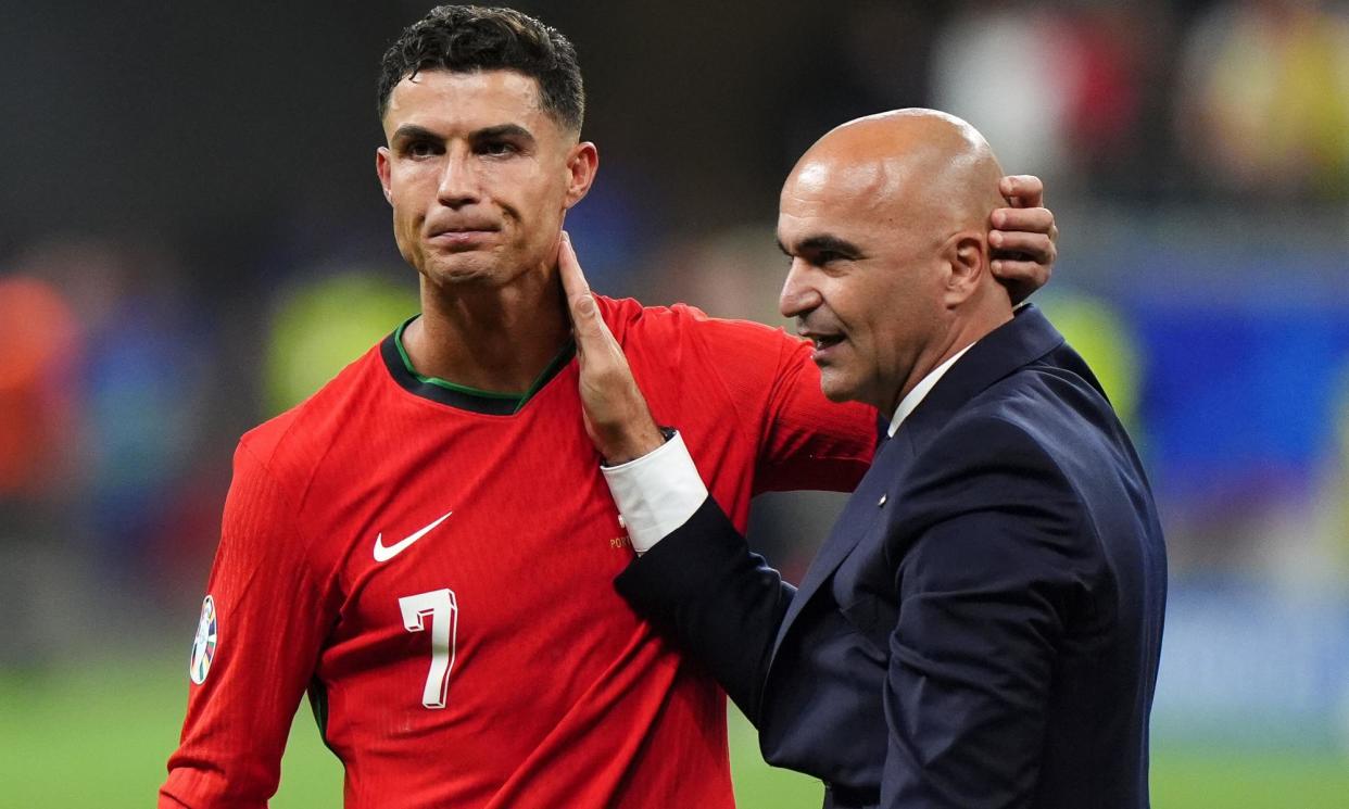 <span>Portugal's Cristiano Ronaldo (left) with Portugal manager Roberto Martínez (right) after winning the penalty shootout.</span><span>Photograph: Bradley Collyer/PA</span>