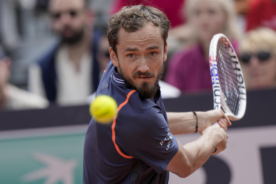 FILE - Daniil Medvedev returns the ball to Emil Ruususuori at the Italian Open tennis tournament, in Rome, Sunday, May 14, 2023. Medvedev is expected to compete at Wimbledon next week. (AP Photo/Andrew Medichini, File)