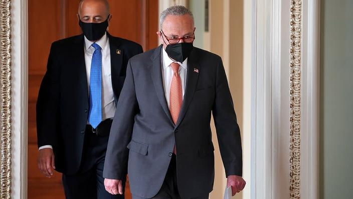 Majority Leader Charles Schumer (D-N.Y.) heads to a press conference after a virtual policy luncheon on Tuesday, January 4, 2022.