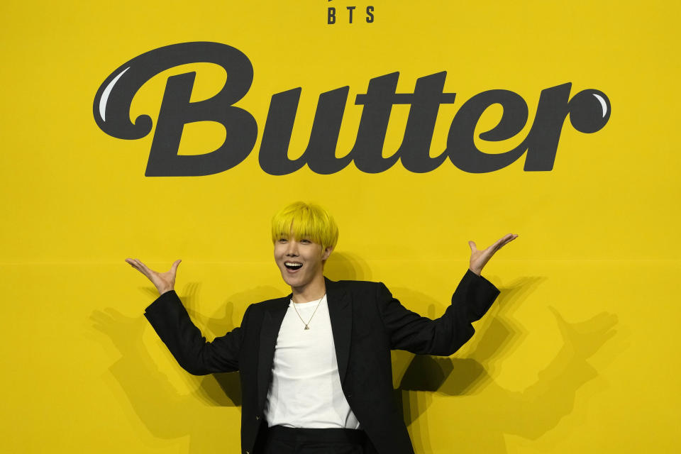 FILE - J-Hope, a member of South Korean K-pop band BTS, poses for photographers ahead of a press conference to introduce their new single "Butter" in Seoul, South Korea, May 21, 2021. J-Hope entered a South Korean boot camp Tuesday, April 18, 2023 to start his 18-month compulsory military service, becoming the group’s second member to join the country's army. (AP Photo/Lee Jin-man, File)