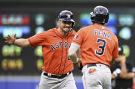 Houston Astros Trey Mancini is congratulated by Jeremy Pena after hitting a double against the Baltimore Orioles in the 10th inning of a baseball game, Sunday, Sept. 25, 2022, in Baltimore. (AP Photo/Gail Burton)