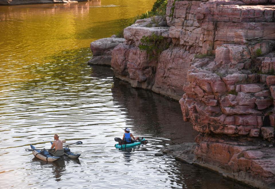 Anglers kayak Split Rock Creek through Palisades State Park looking for a spot to fish on Wednesday, July 20, 2022, in South Dakota.