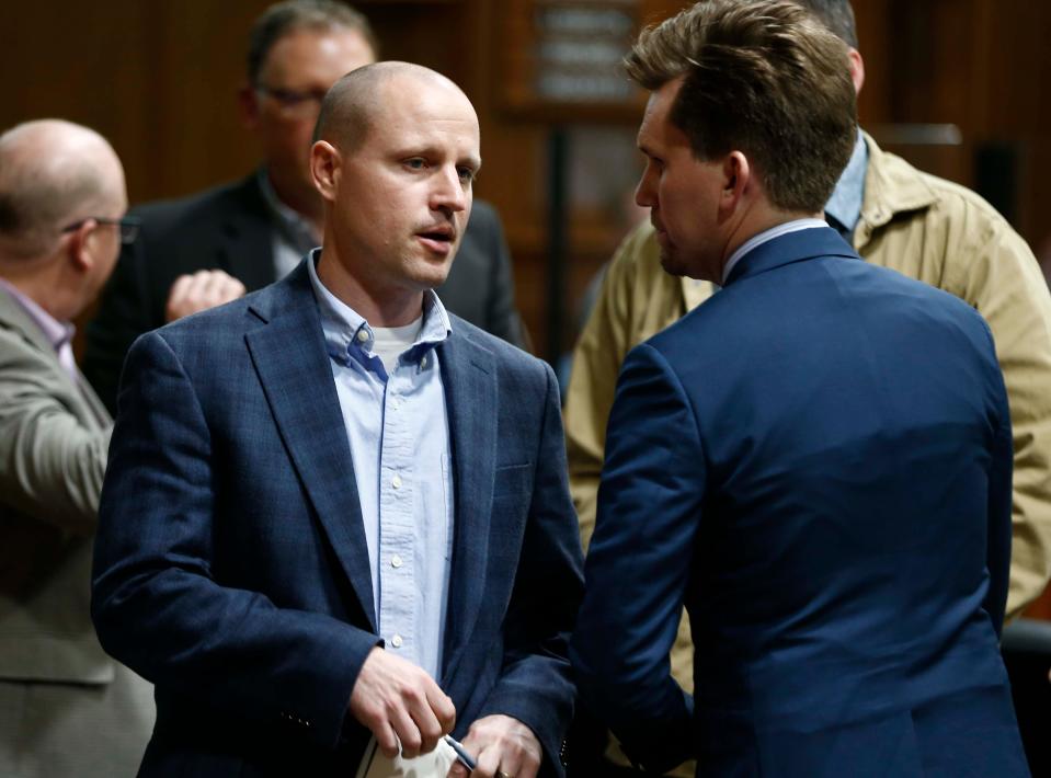 Developer Ralph Duda, left, consults with his legal council during the City of Springfield Planning and Zoning hearing at City Hall on April 6, 2023.