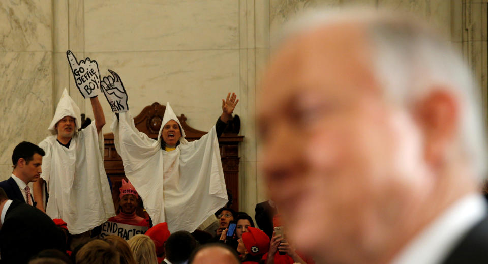 Protesters dressed as Klansmen disrupt the start of a Senate Judiciary Committee confirmation hearing for U.S. Attorney General nominee Jeff Sessions on&nbsp;Jan.&nbsp;10, 2017. (Photo: Kevin Lamarque/Reuters)