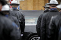 Law enforcement personnel line the streets as the hearse carrying the casket of Capitol Police Officer William "Billy" Evans arrives at St. Stanislaus Kotska Church for his funeral on Thursday, April 15, 2021, in Adams, Mass. Evans was killed this month when a driver struck him and another officer at a barricade outside the Senate. (Stephanie Zollshan/The Berkshire Eagle via AP)