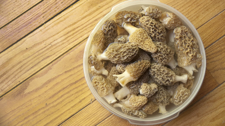 Bowl of morels soaking in water