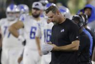 Detroit Lions head coach Dan Campbell looks down at his hat during the second half of an NFL football game against the Green Bay Packers Monday, Sept. 20, 2021, in Green Bay, Wis. The Packers won 35-17. (AP Photo/Matt Ludtke)