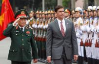 U.S. Defense Secretary Mark Esper reviews the guard of honour with Vietnam's Defence Minister General Ngo Xuan Lich in Hanoi