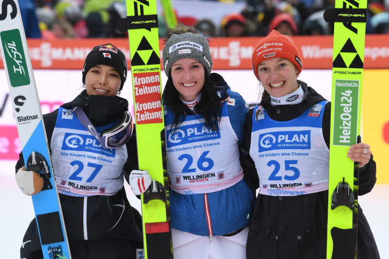 (L-R) Japan's second-placed Sara Takanashi, Austria's winner Winner Jacqueline Seifriedsberger and Germany's third-placed Katharina Schmid celebrate together after the Women's large hill competition of the Ski jumping World Cup in Willingen. Swen Pförtner/dpa